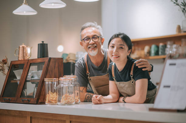 A small business owner and their team member